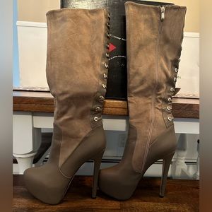 8 1/2 over the knee boots. Worn once. Really cute. 6 inch heel.  By Luichiny